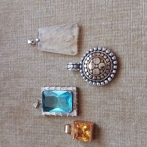 Collection of 4 Silver and Gold Tone Pendants